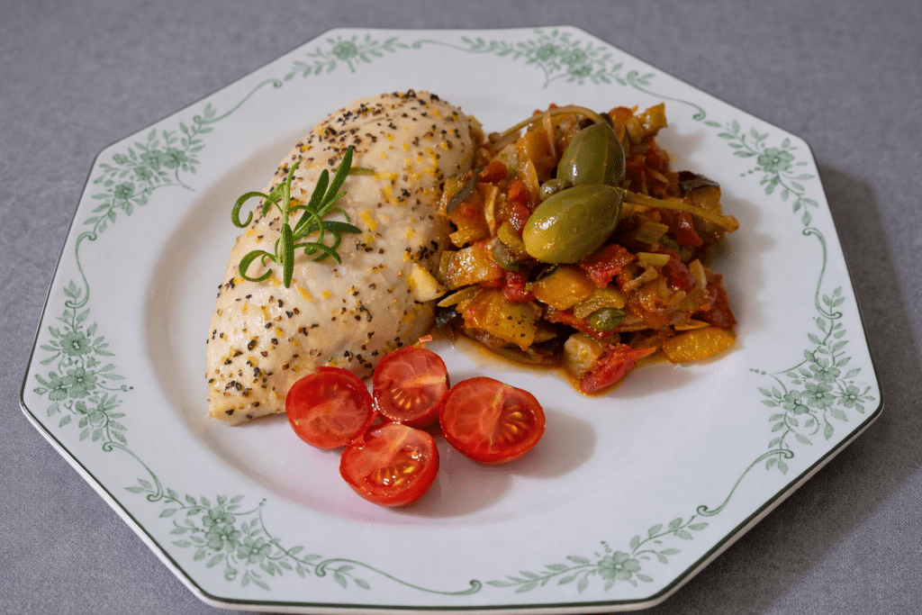 Lemon and rosemary chicken served with Sicilian caponata made with eggplant, tomatoes, capers and olives.