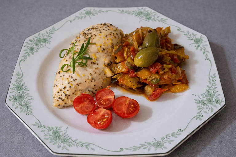 Lemon and rosemary chicken served with Sicilian caponata made with eggplant, tomatoes, capers and olives.